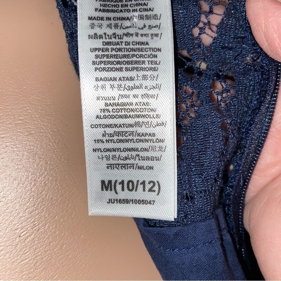 Guess Los Angeles baby lace dress has a gauze skirt just perfect for twirling. - Picture 8 of 8